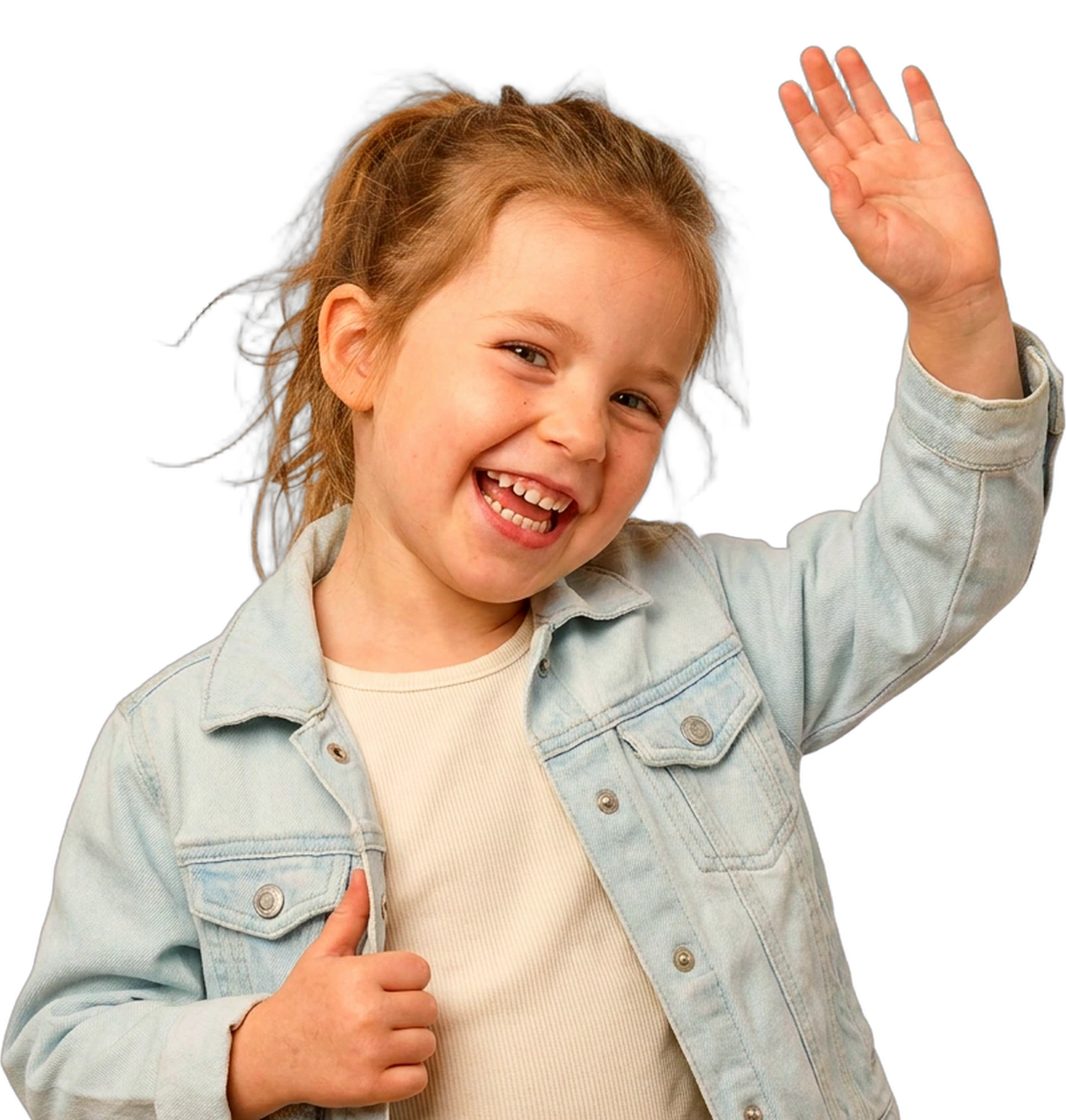A laughing preschooler in a pale blue denim jacket waving at the camera with her palm open, her other thumb hooked into her jacket pocket