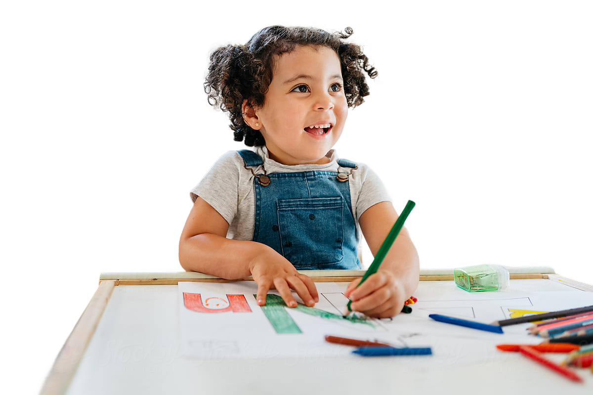 Smiling child playing with art supplies